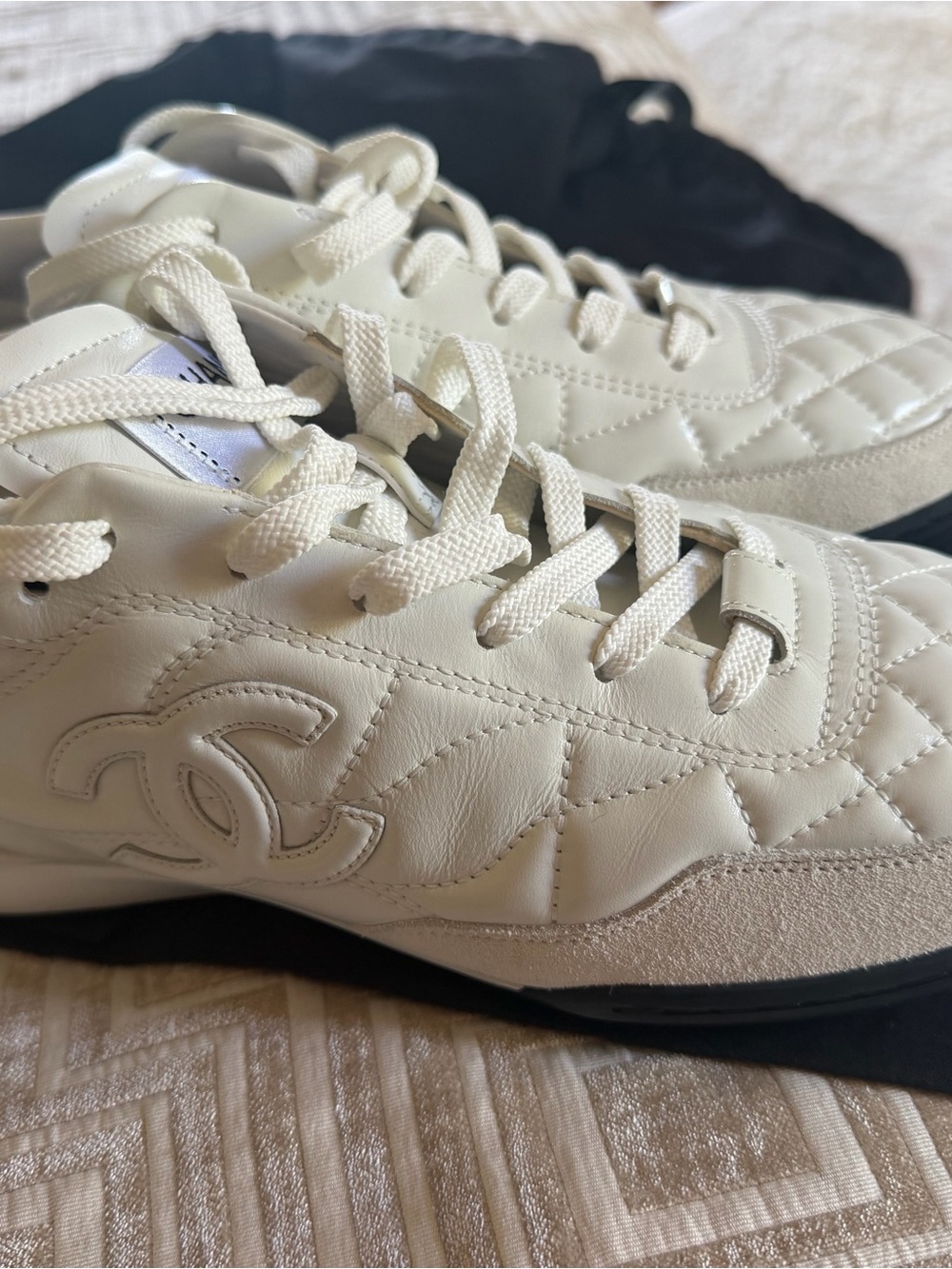 CHANEL Cream Quilted Leather Low-Top Sneakers